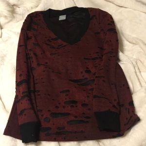 Red and black distressed long sleeve top